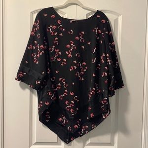 Stylish black blouse with pink and white pattern with handkerchief hemline